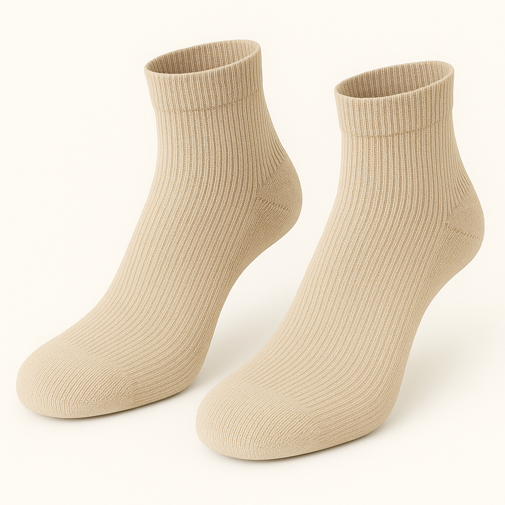 Pair of beige socks on a white background