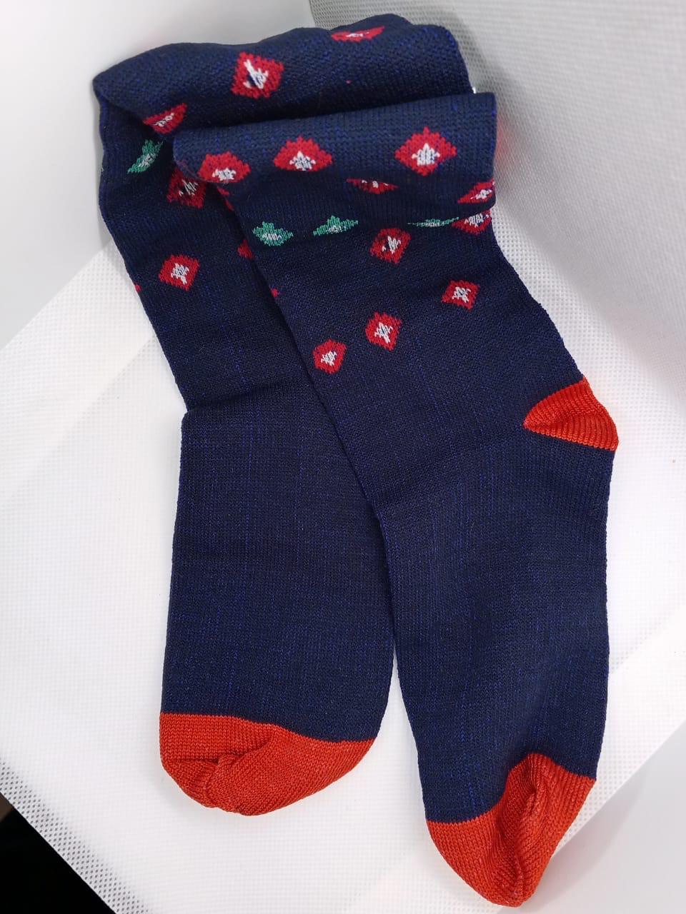 Navy blue low-cut socks with red and green pattern from Trainers Feet on a white background.